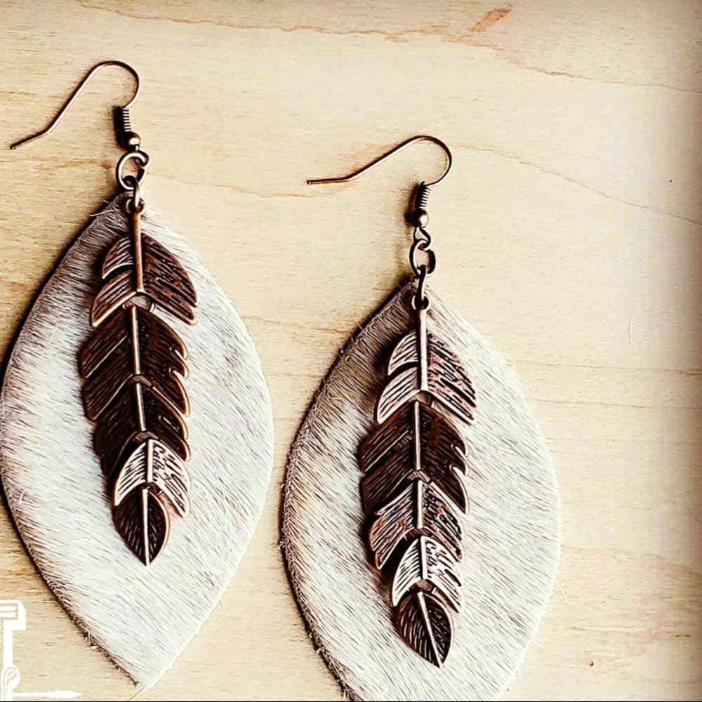 Hair on hide oval earrings with copper feather